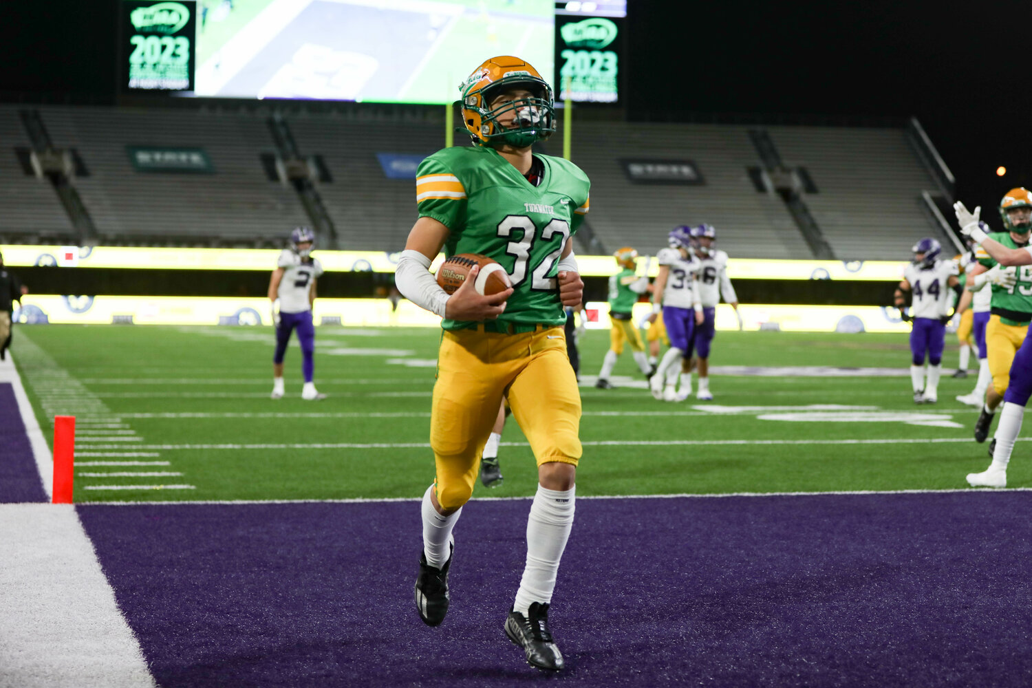 Tumwater's Peyton Davis in the endzone after a TD run  during a 60-30 loss to Anacortes Dec. 2. at Husky Stadium.